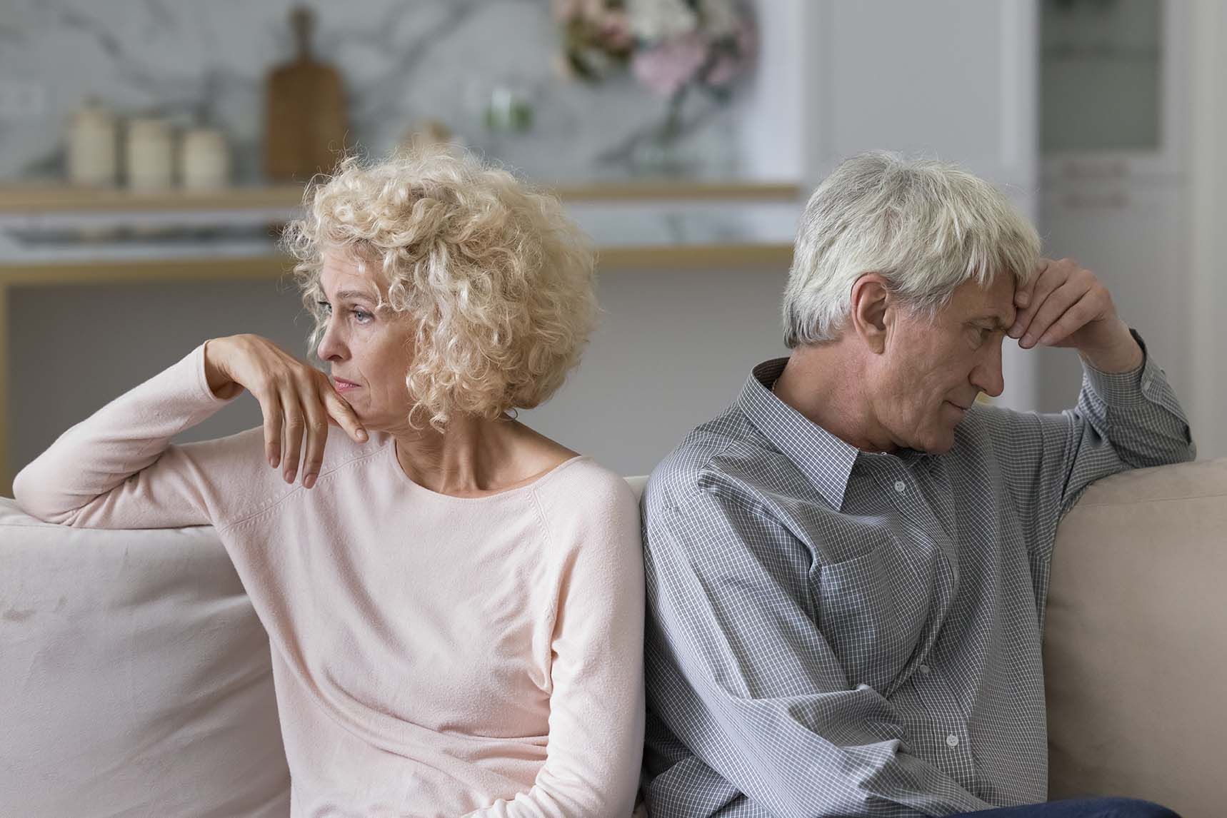 Older couple sitting across from each other during a gredivorce consultation on Long Island.