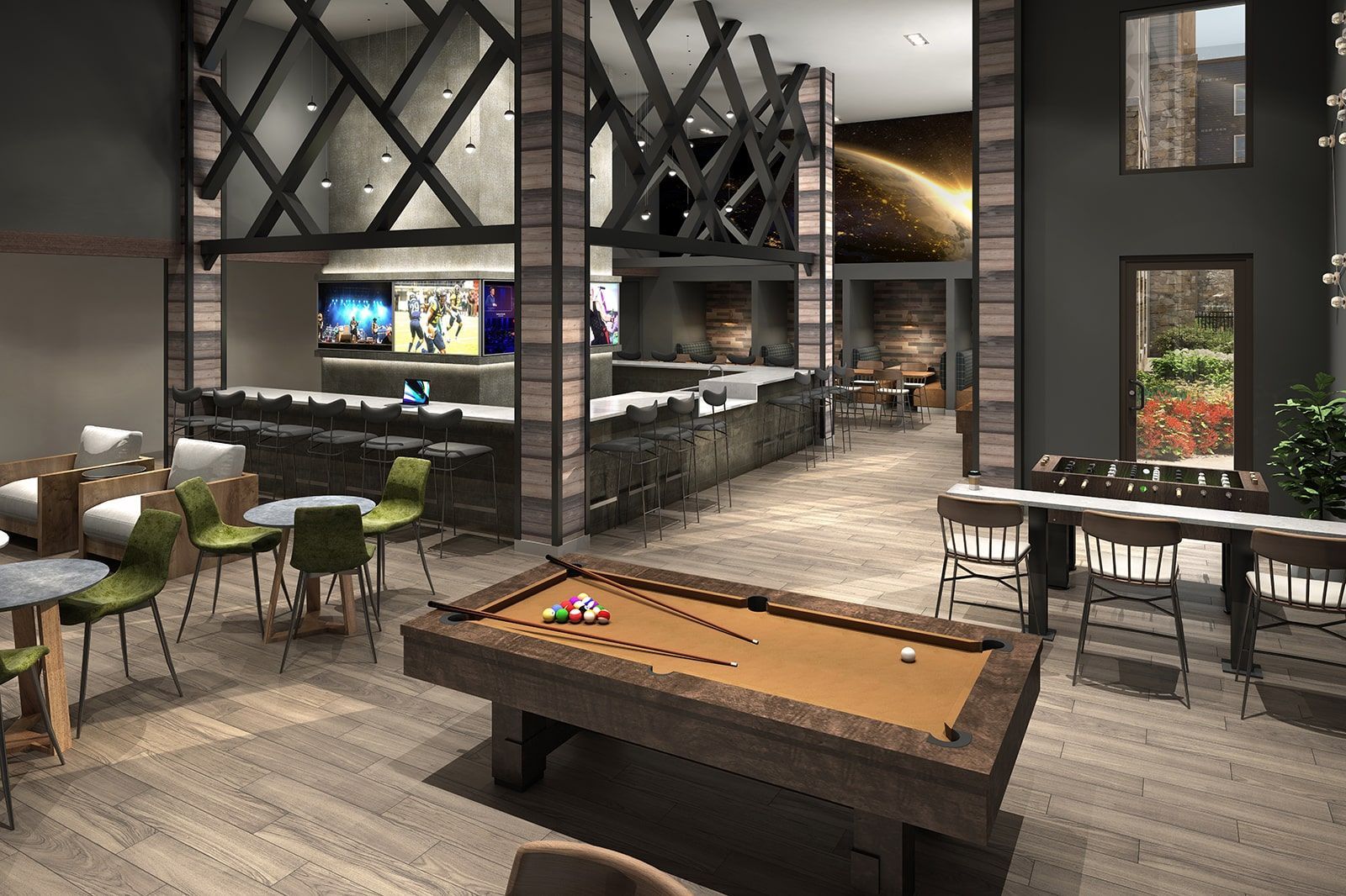 Interior of a modern clubhouse with a pool table, foosball, TV wall, and lounge seating.