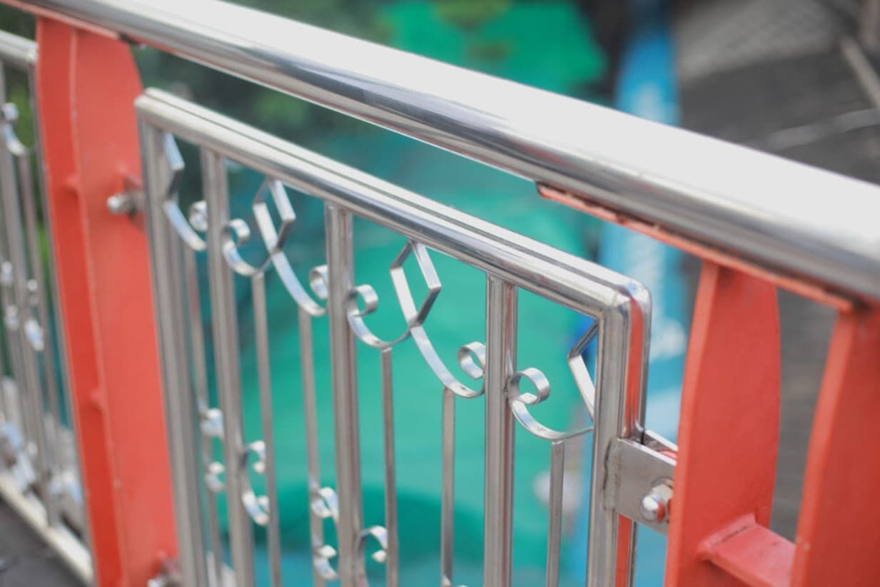 A Close Up Of A Stainless Steel Railing On A Bridge — Rockhampton Powdercoating & Fence Panels in Park Avenue, QLD