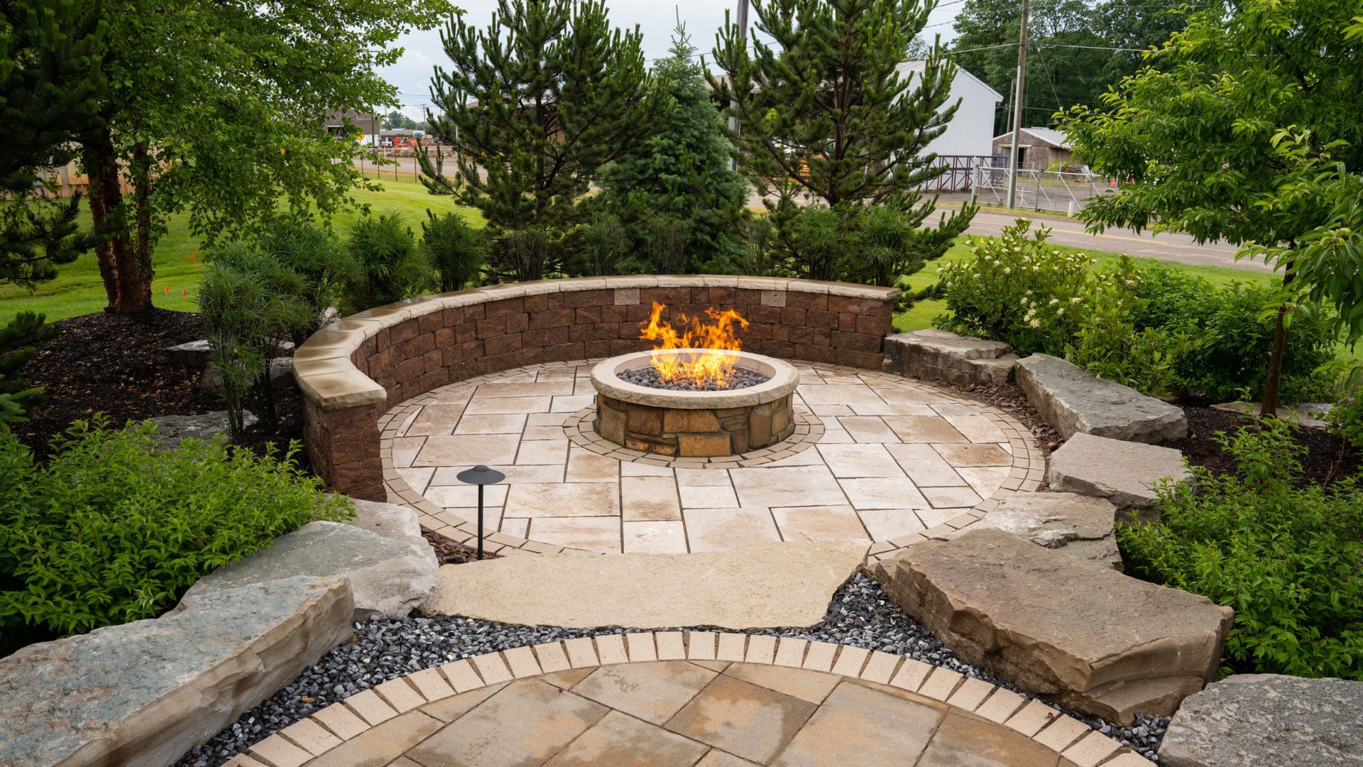 There is a fire pit in the middle of the patio.