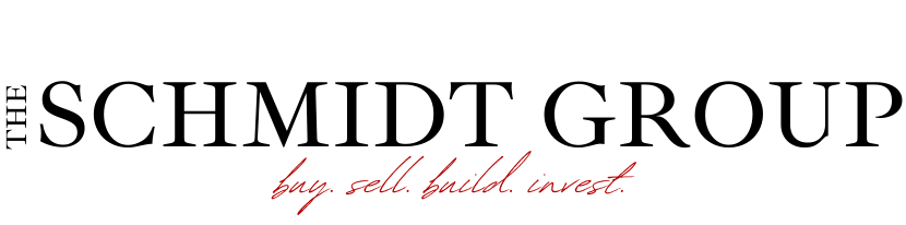 A logo for the schmidt group that says buy sell build invest
