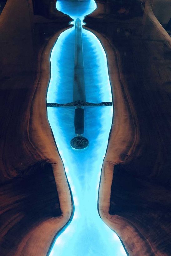 A blue light is shining on a piece of wood
