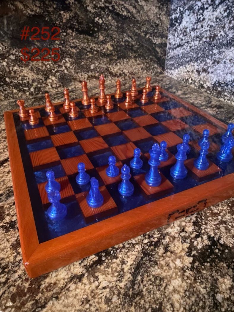 A wooden tray with a purple stripe on it is sitting on a carpet.