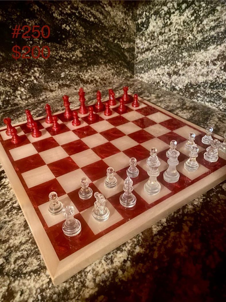 A wooden chess board with blue pieces on it