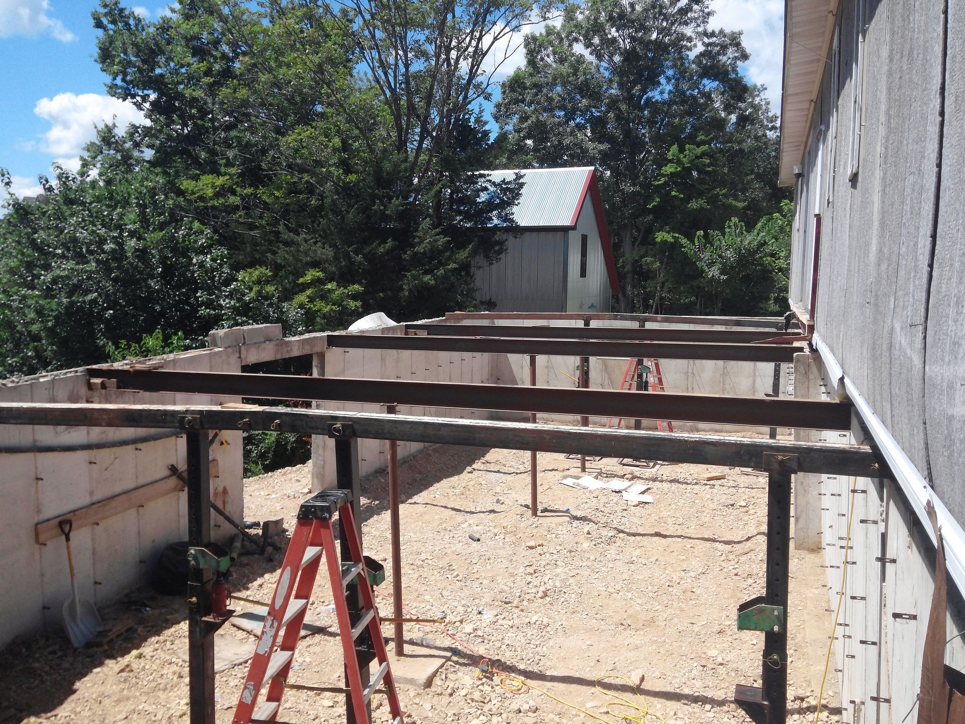 A Ladder Is Sitting in Front of A Building Under Construction | Winfield, MO | Excalibur Manufactured Housing Services LLC