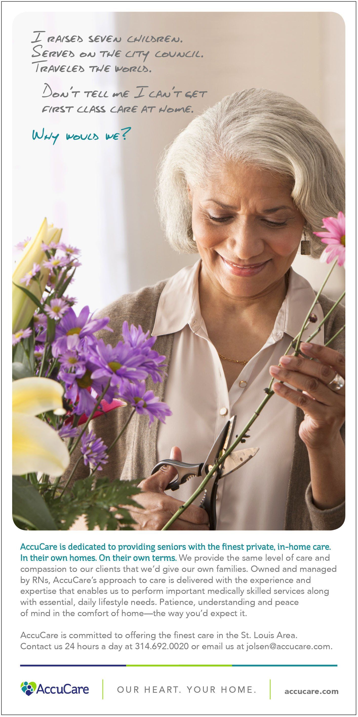 An older woman is holding a bouquet of flowers and smiling.