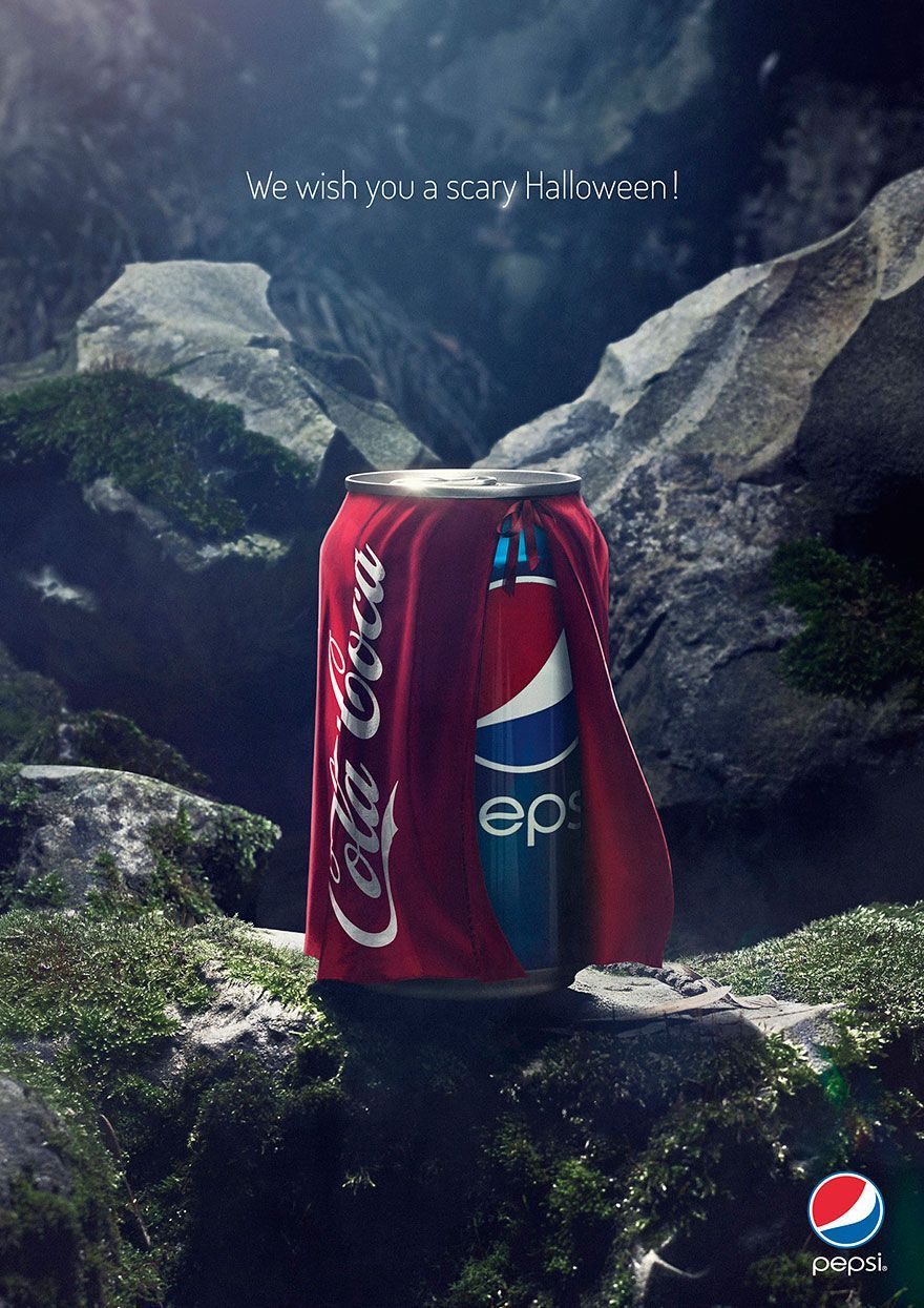 A can of pepsi and a can of coca cola on a rock