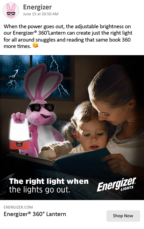 A woman is reading a book to a child while a pink bunny is holding a lantern.