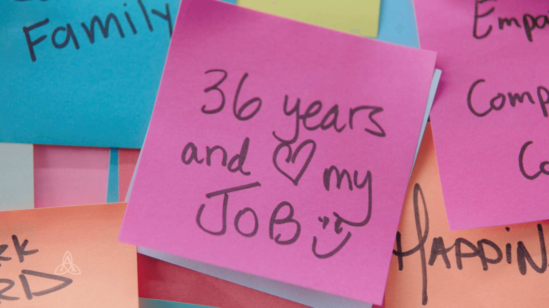 A pink post it note says 36 years and i love my job