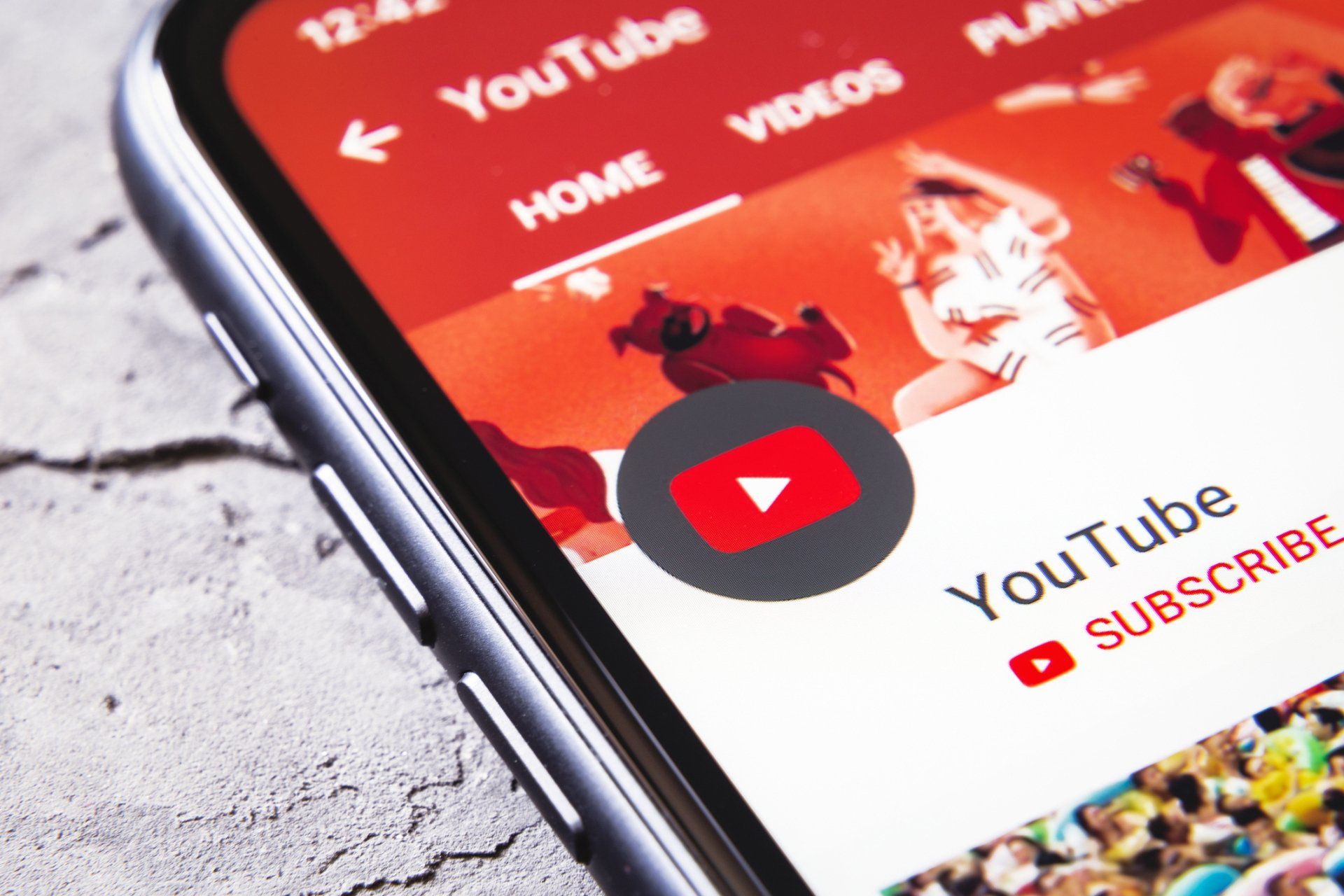 A close up of a youtube app on a cell phone