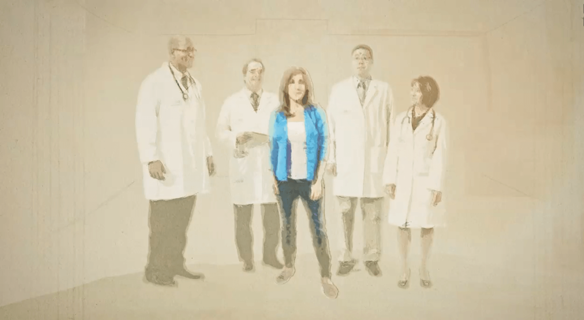 A group of doctors and nurses are standing next to each other in a room.