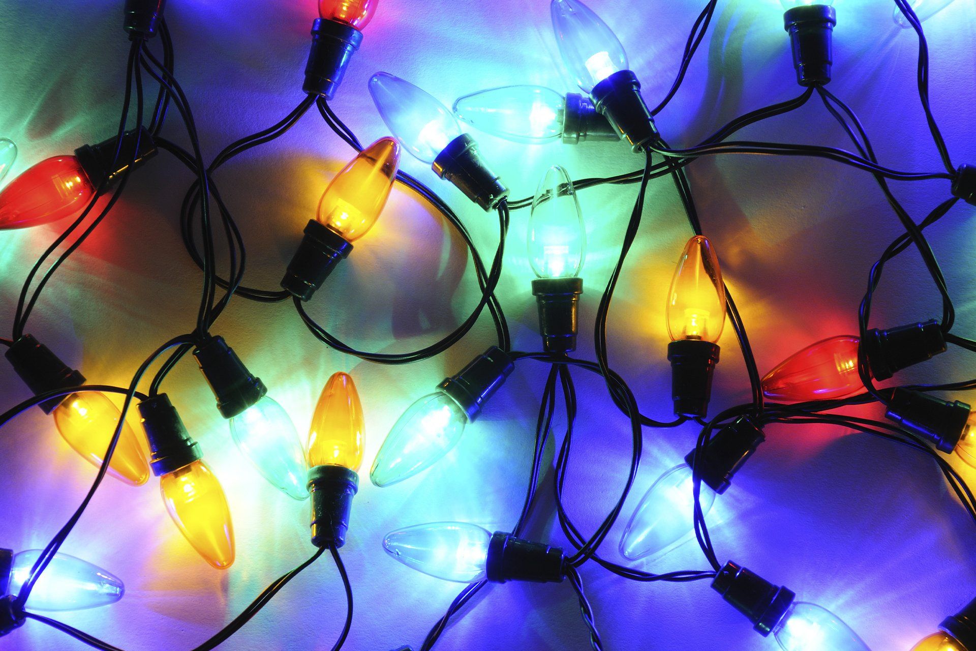 A bunch of colorful christmas lights on a string