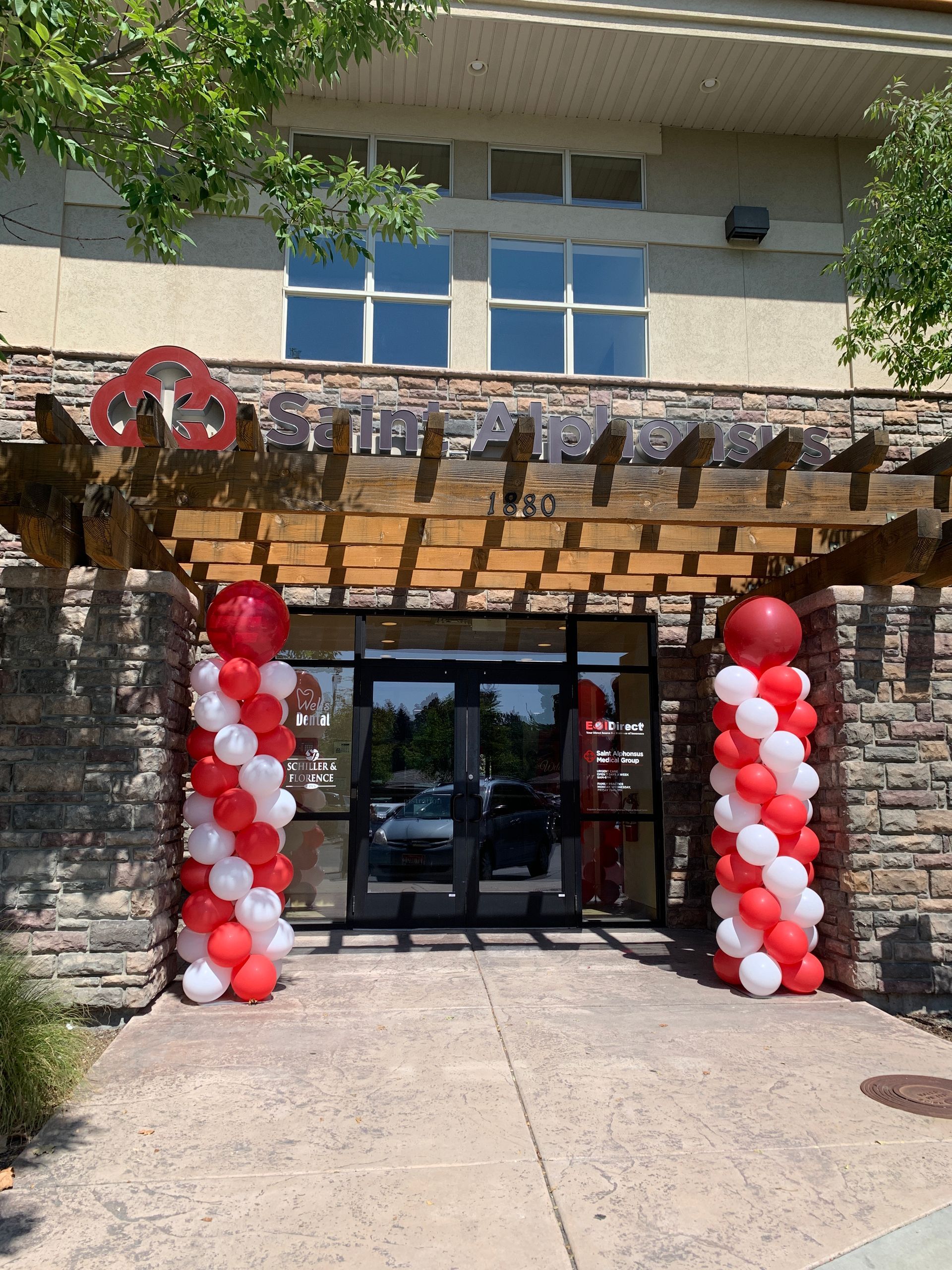 A building with red and white balloons in front of it