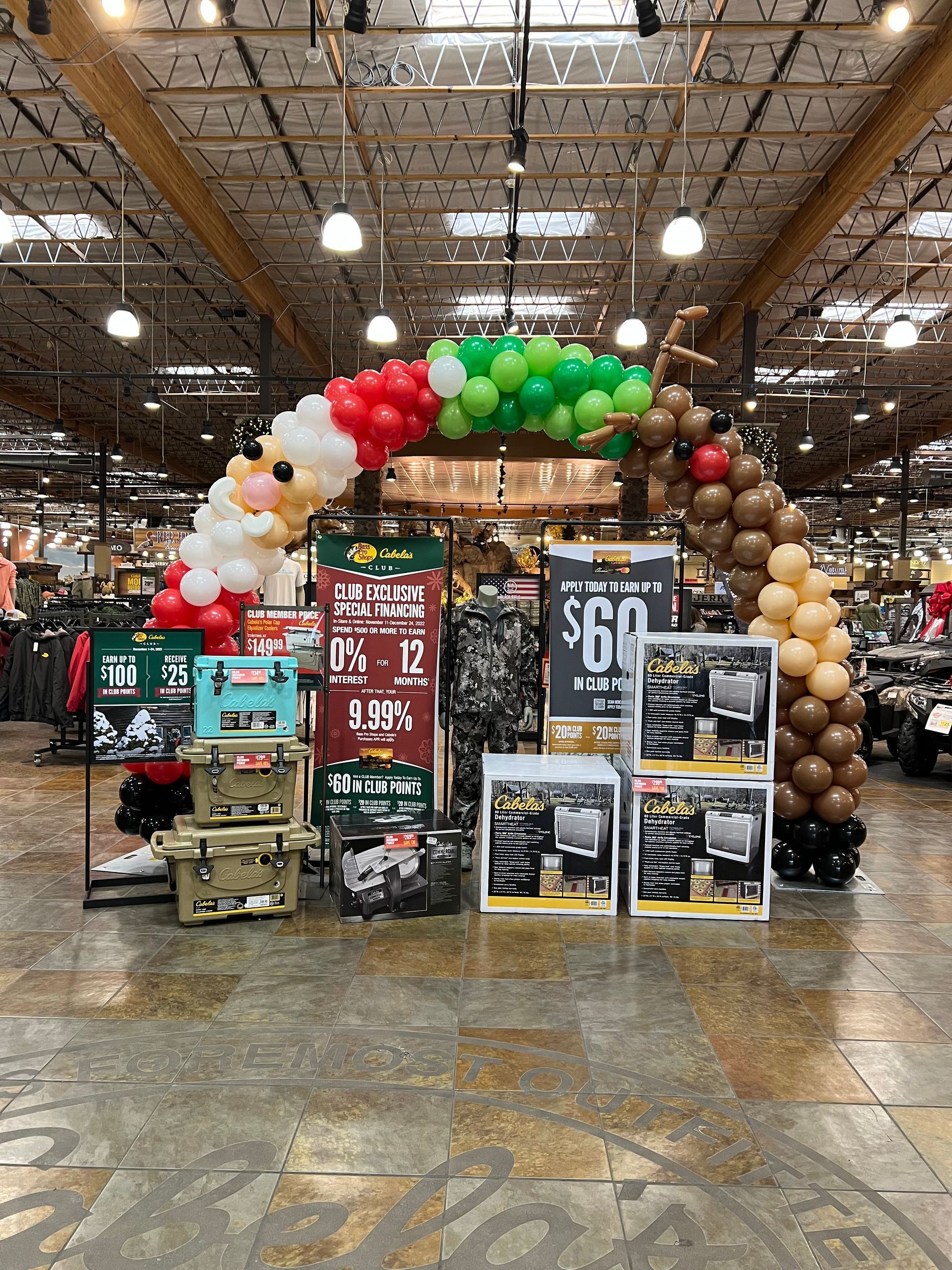 A store filled with lots of balloons and signs.