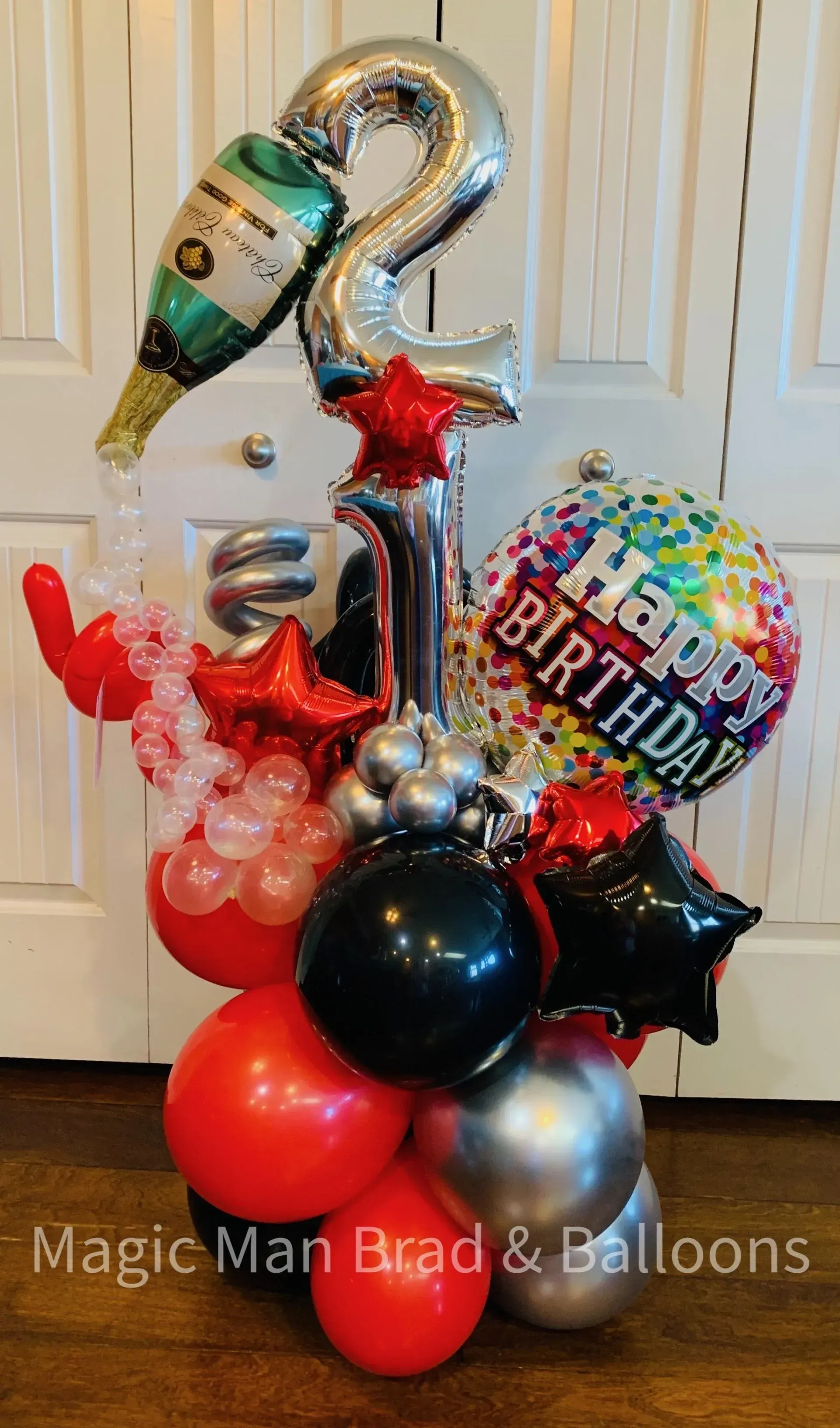 A bunch of balloons are sitting on top of each other on a table.