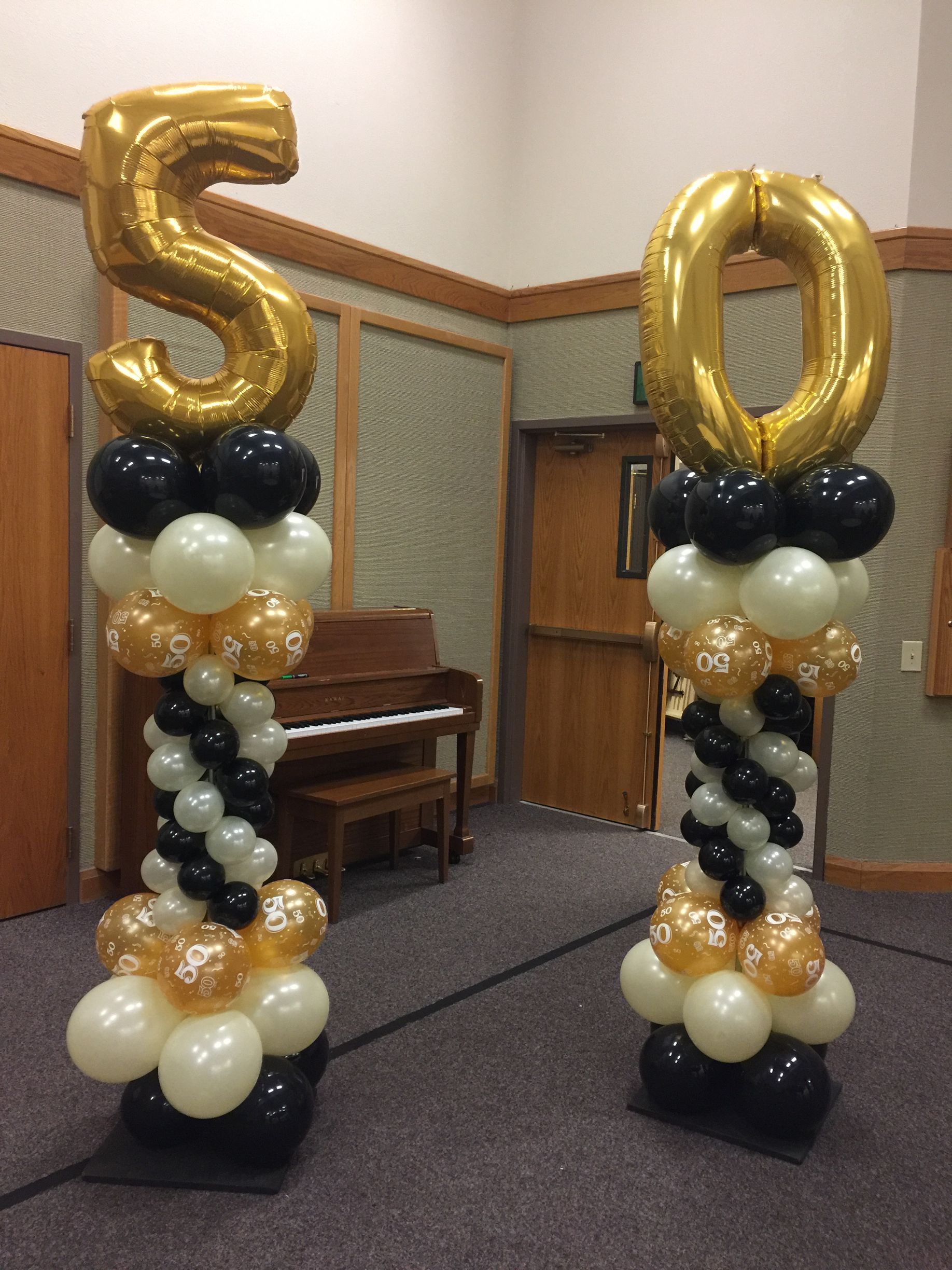 Two columns made of balloons with the number 50 on them