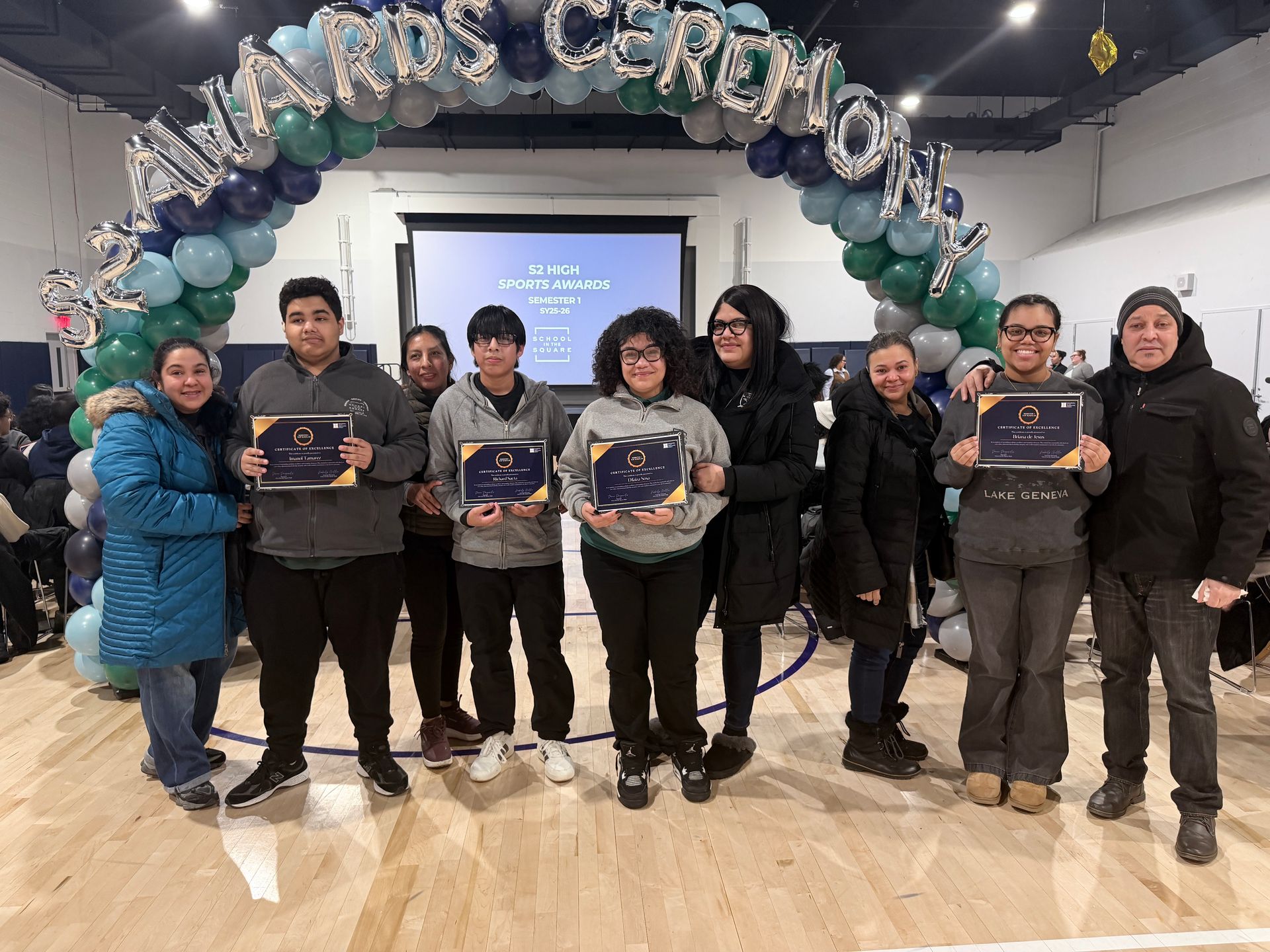 Photo of families with their S2 students