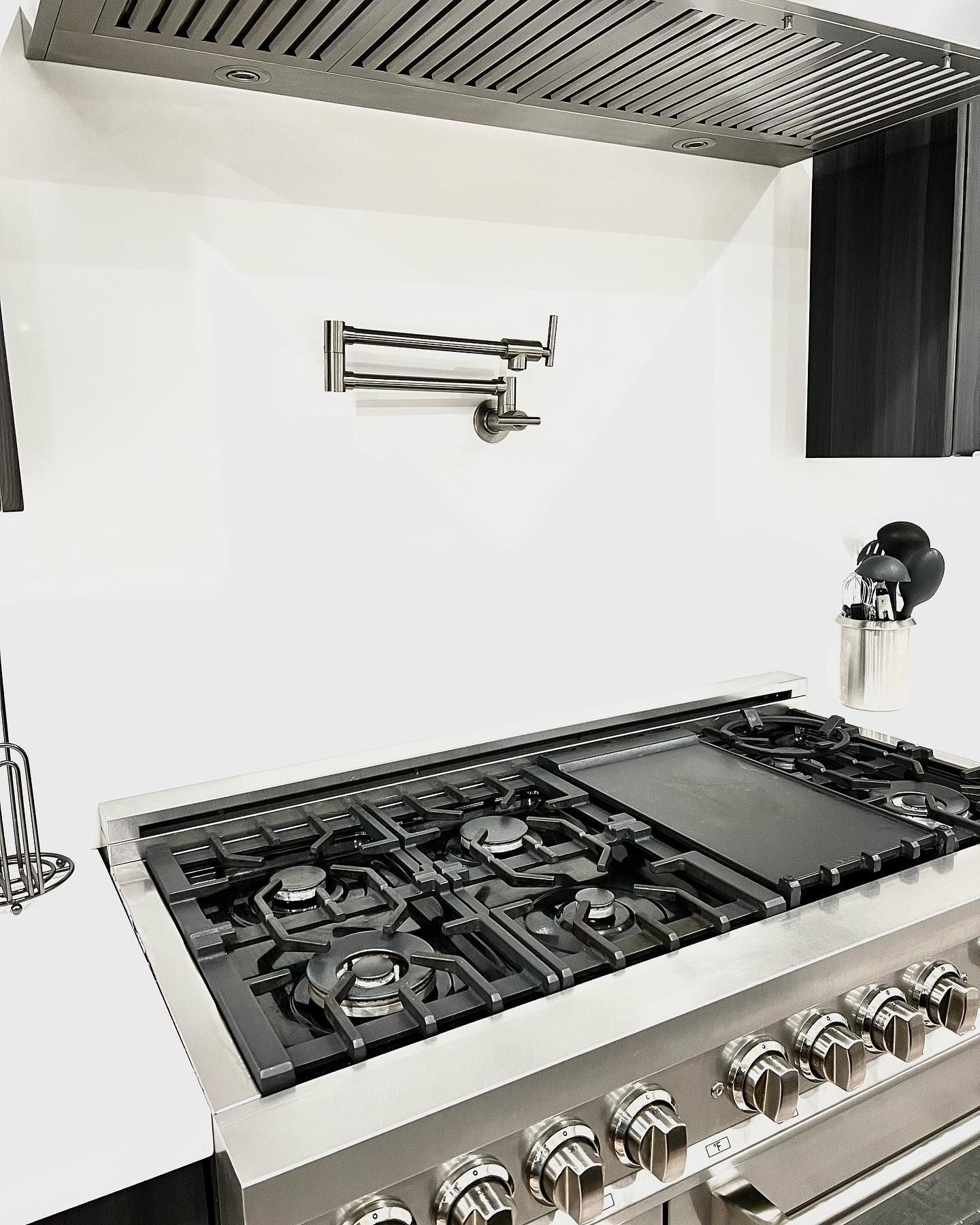 A stove top oven is sitting on top of a counter in a kitchen.