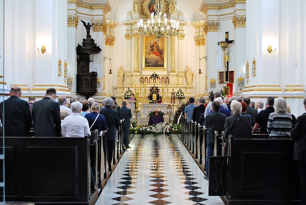 A Large Group of People Are Sitting in a Church — Hutchinson Family Funerals In Taree, NSW