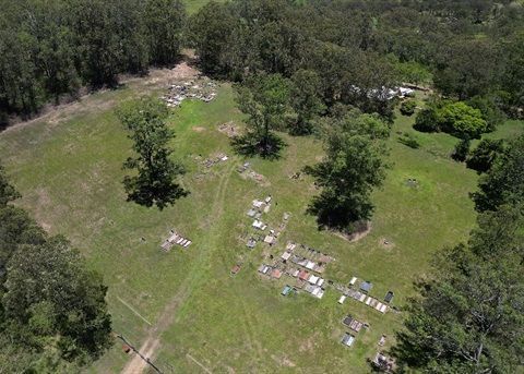 An Aerial View of a Field Surrounded by Trees and Grass — Hutchinson Family Funerals In Taree, NSW