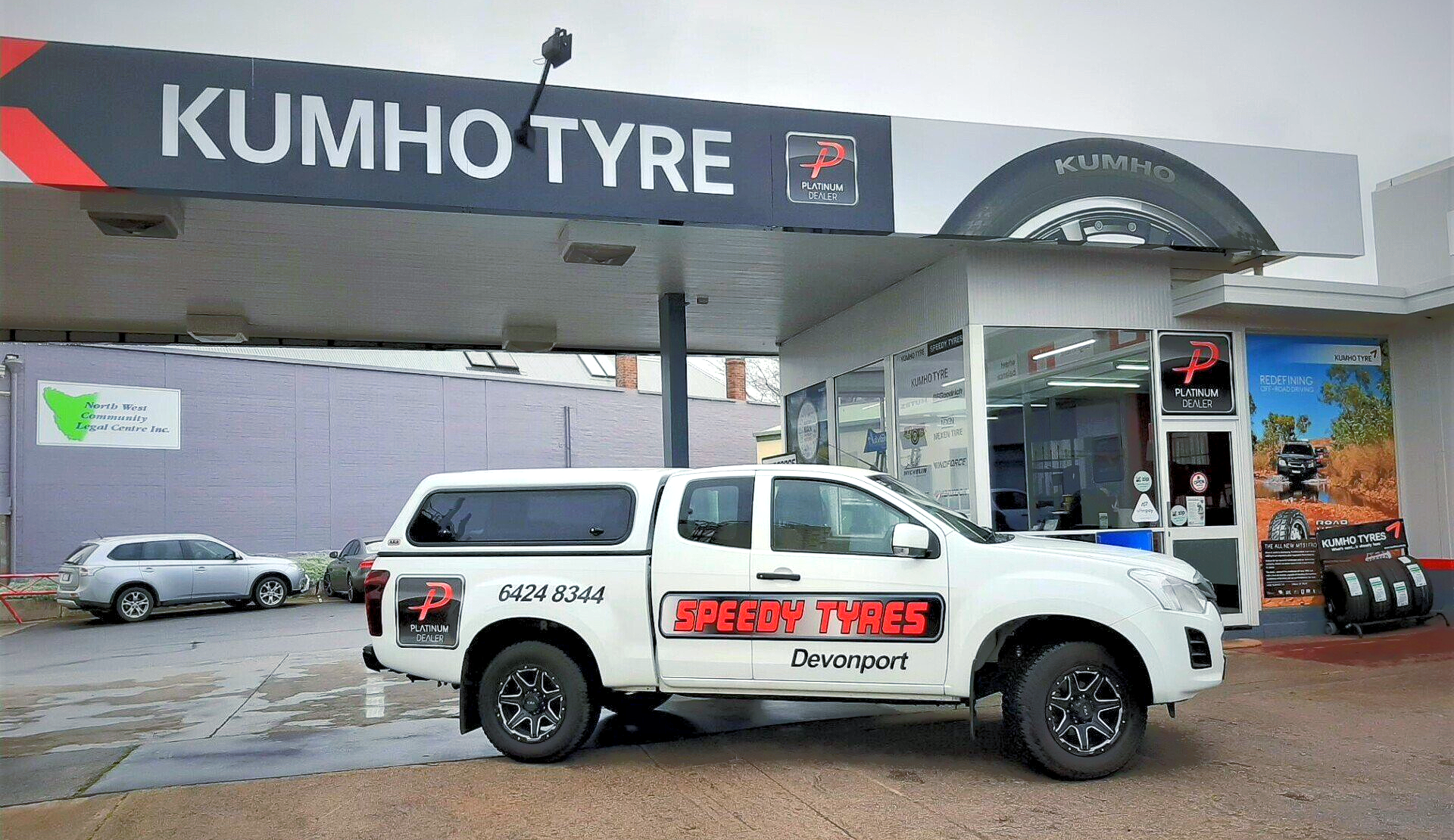 Speedy Tyres Devonport truck outside a Kumho Tyres sign