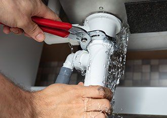 Professional Plumber — Plumber Fixing Sink Pipe in Denton, TX