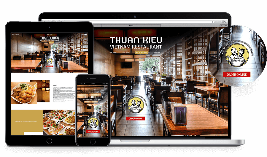a laptop , tablet , and phone are displaying a restaurant website .