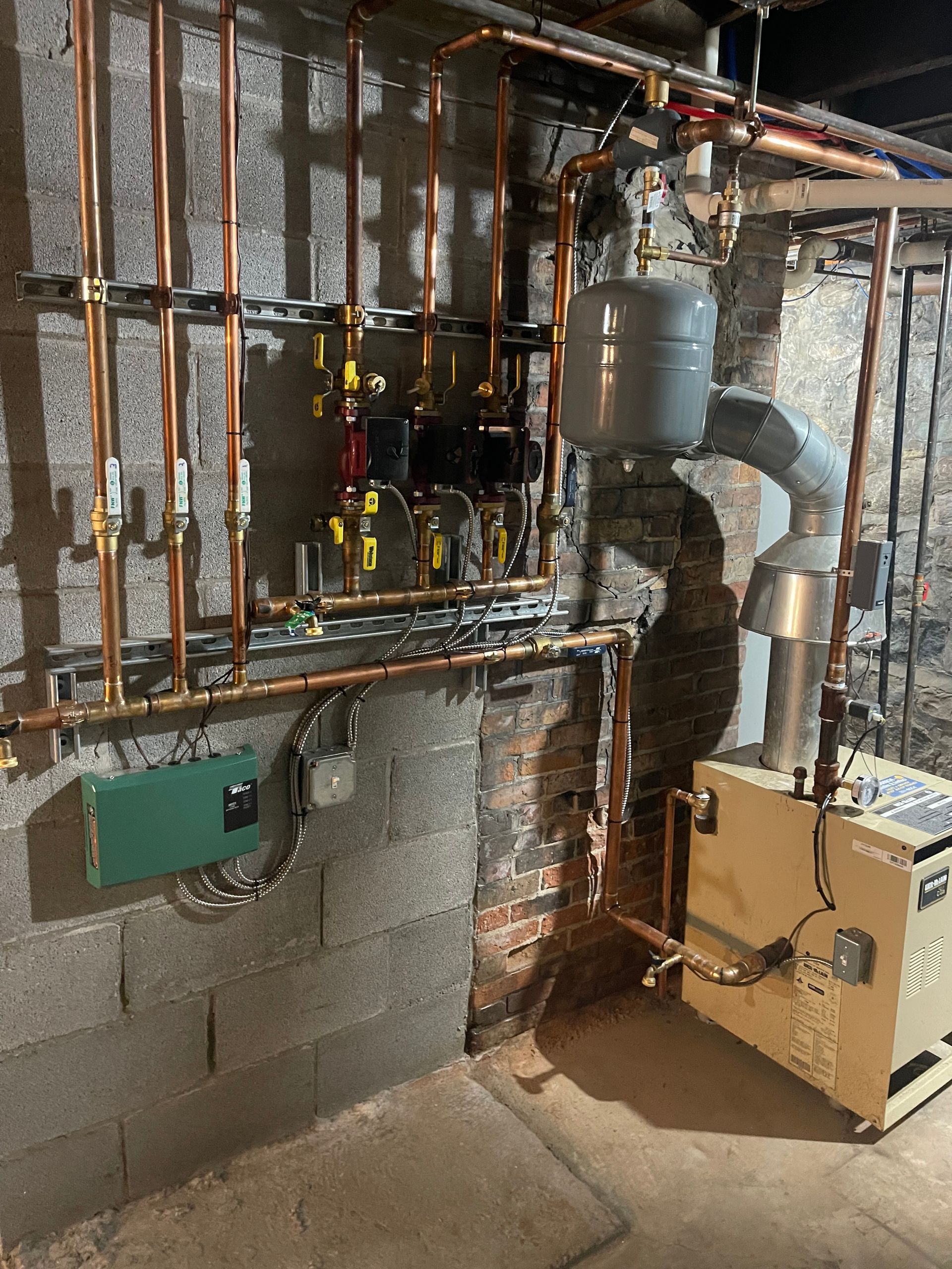 A room with a boiler and a lot of pipes