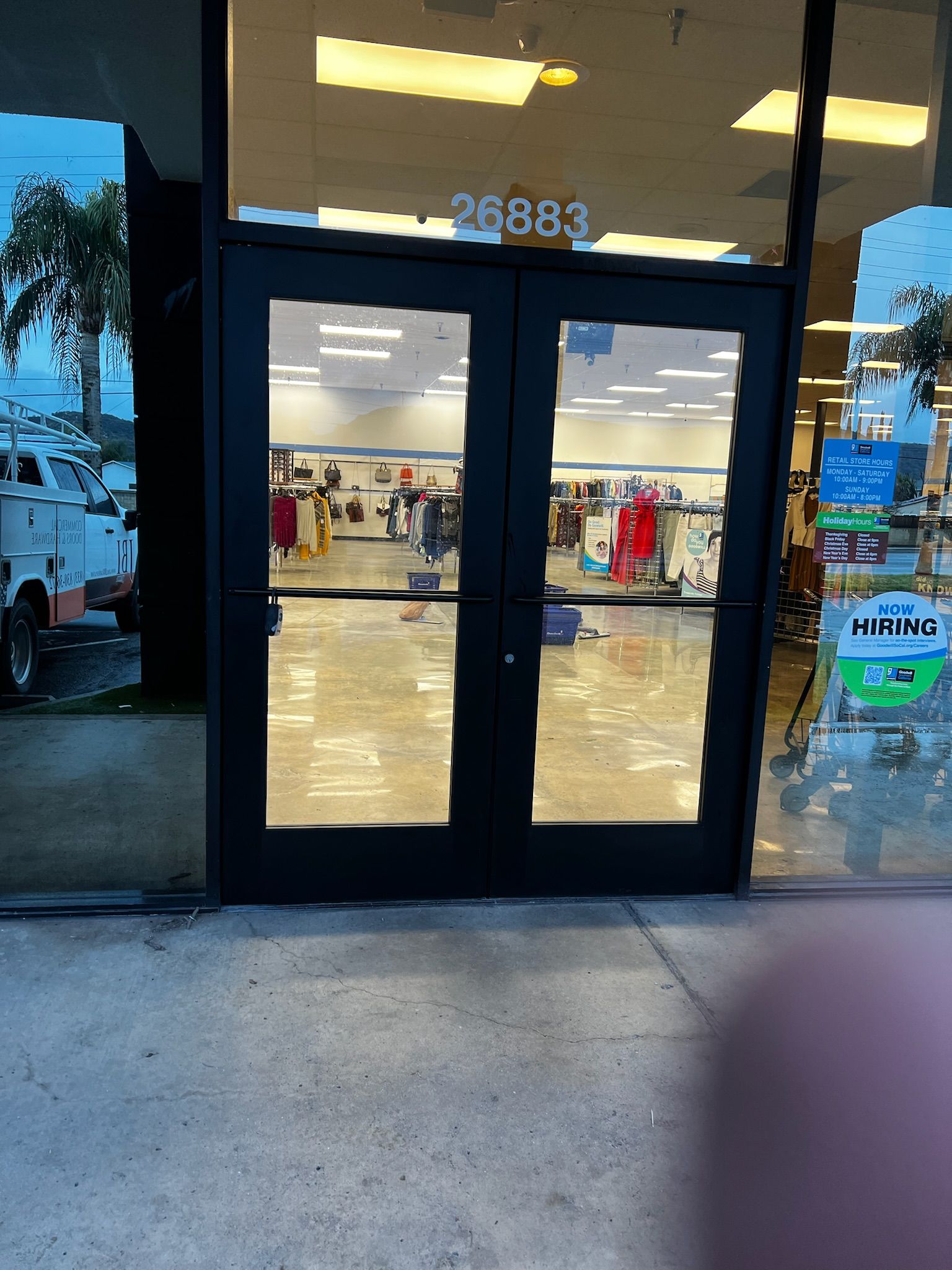 Double doors with a store interior visible through the glass. Address 26883 above the doors.