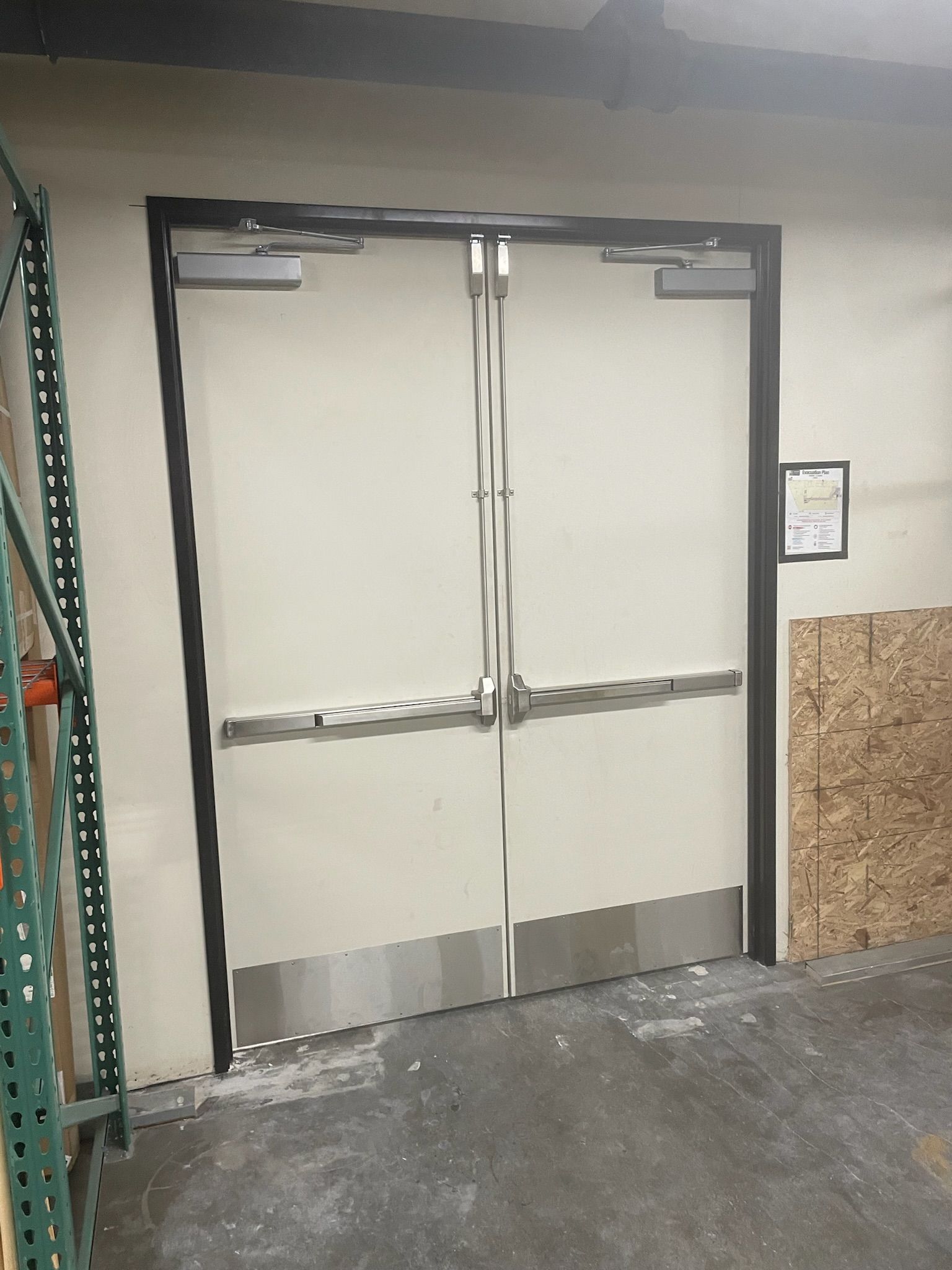 Double white doors with silver hardware, labeled 