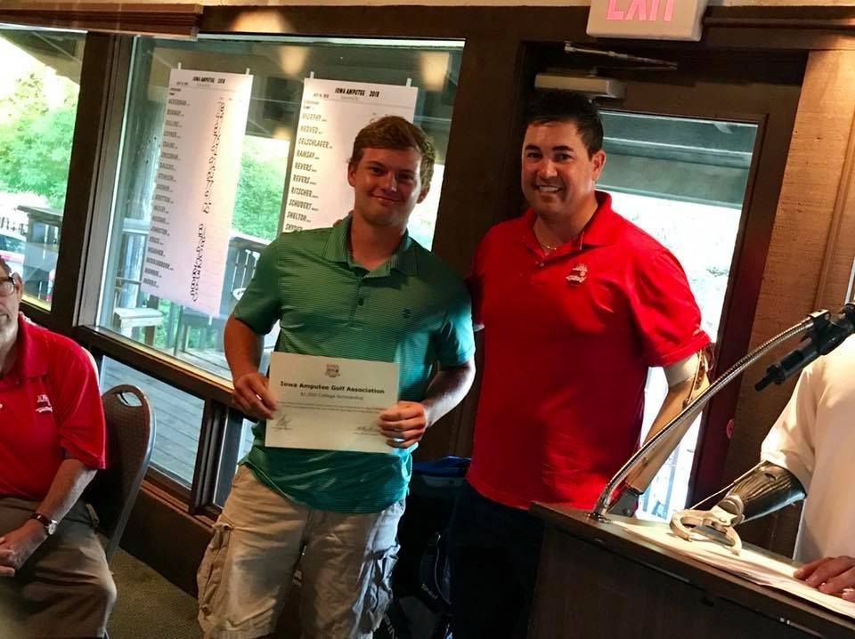 Two men standing next to each other holding a certificate