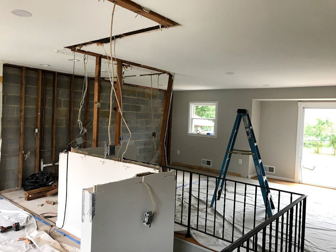 Interior demolition; exposed wall studs, block wall. 