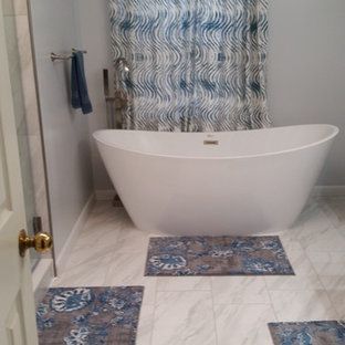 A bathroom with a bathtub and a shower curtain.