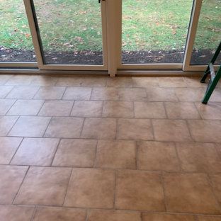 A tiled floor in front of a sliding glass door