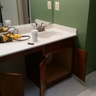 A bathroom vanity with a sink and a mirror