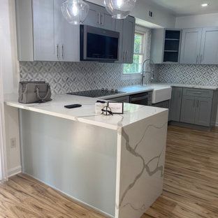 A kitchen with a large island in the middle of the room.