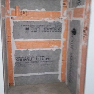 A room with a lot of rboard lite on the walls