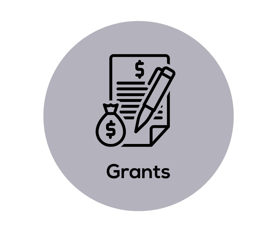 A pen is writing on a piece of paper next to a bag of money.