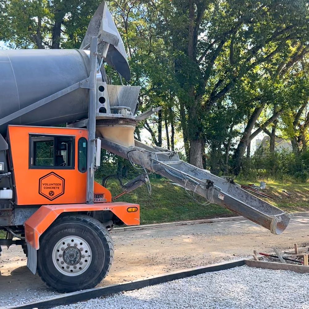 pool patio being completed next to pool deck
