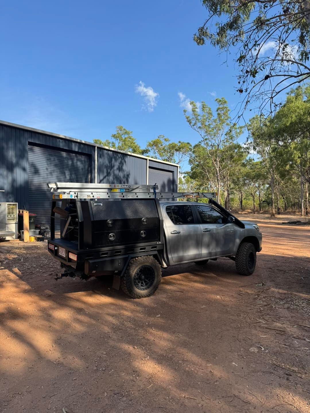 Grey Pickup Truck With Black Utility Bed Parked — Tapped Out Plumbing NT in Bellamack, NT