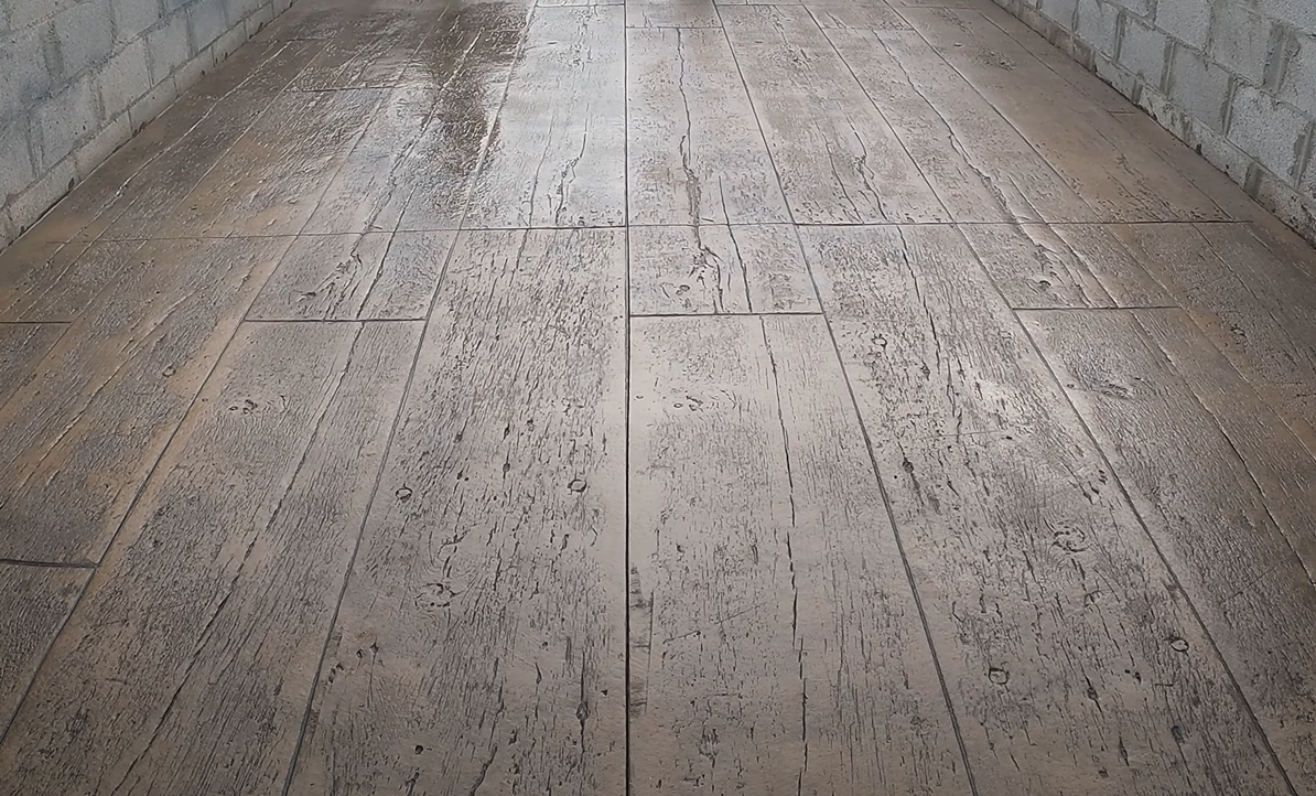 finished decorative stamped concrete patio in barnwood design