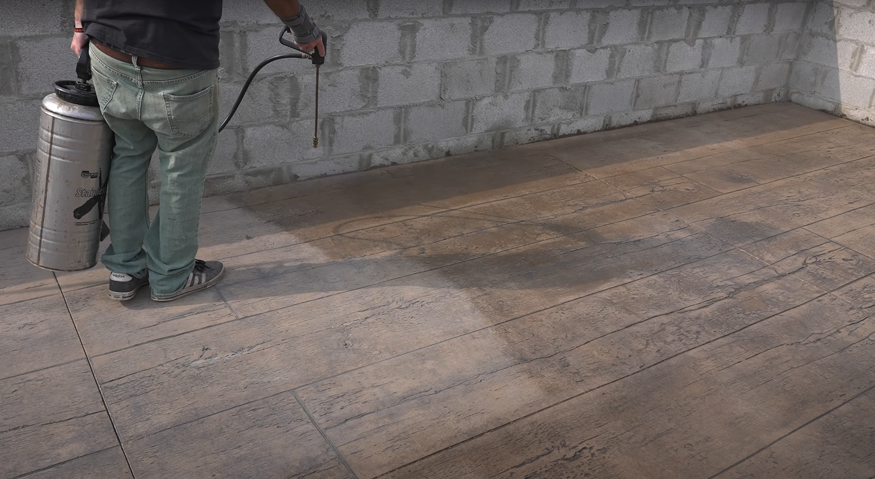 Barnwood stamped concrete slab stained and sealed.