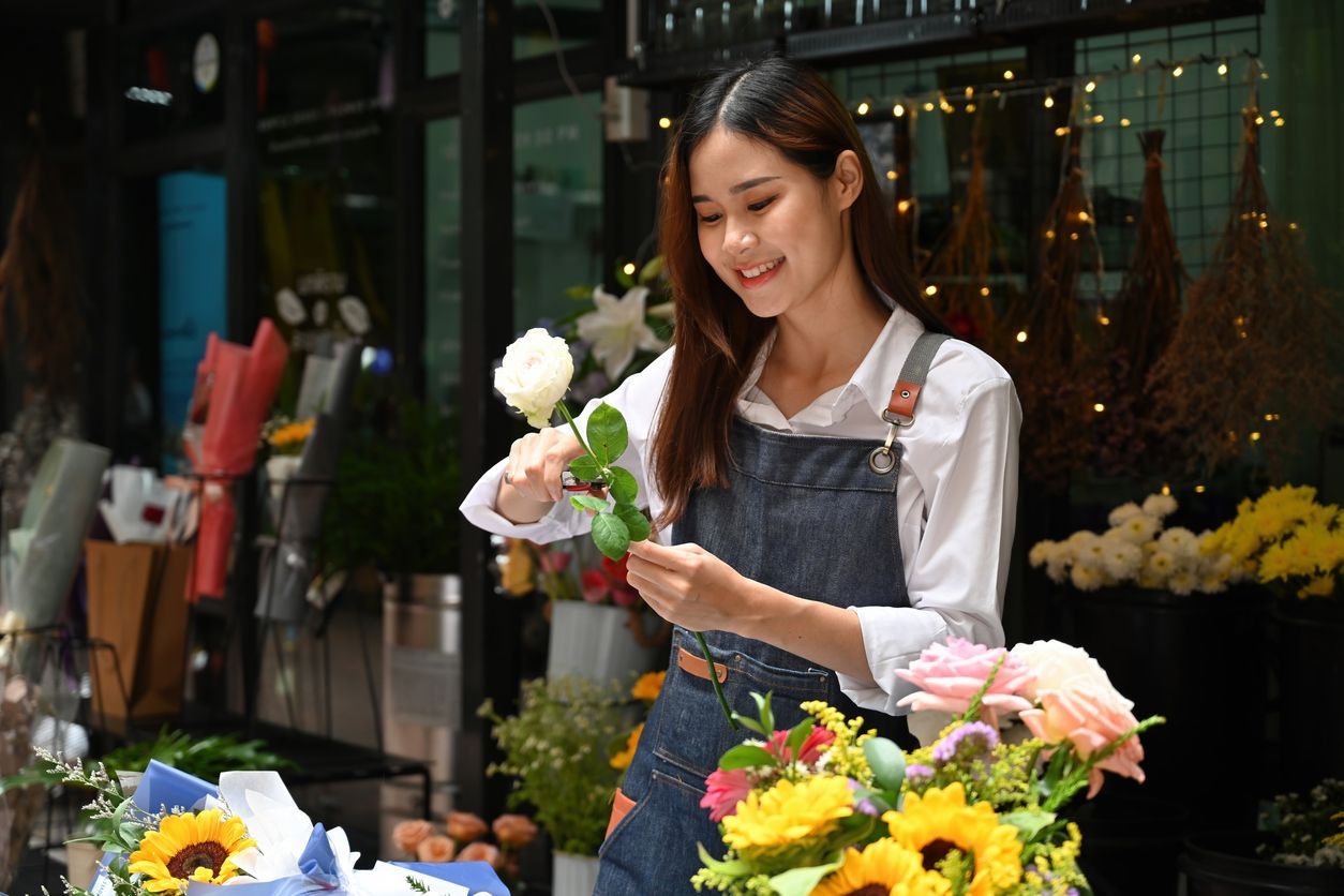 Picture is florist making an arrangement