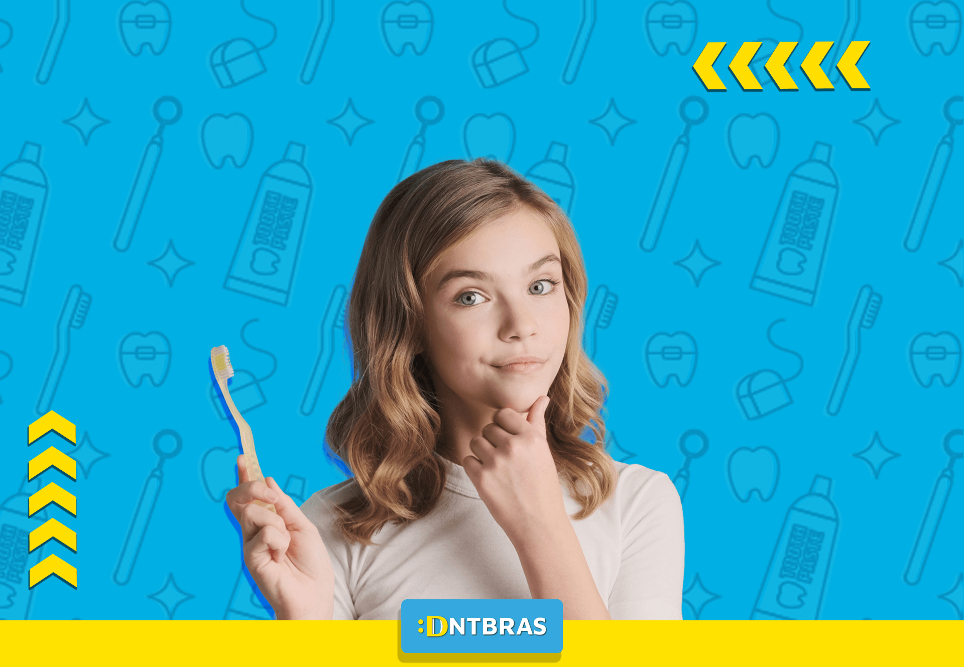 uma jovem está segurando uma escova de dentes na mão.