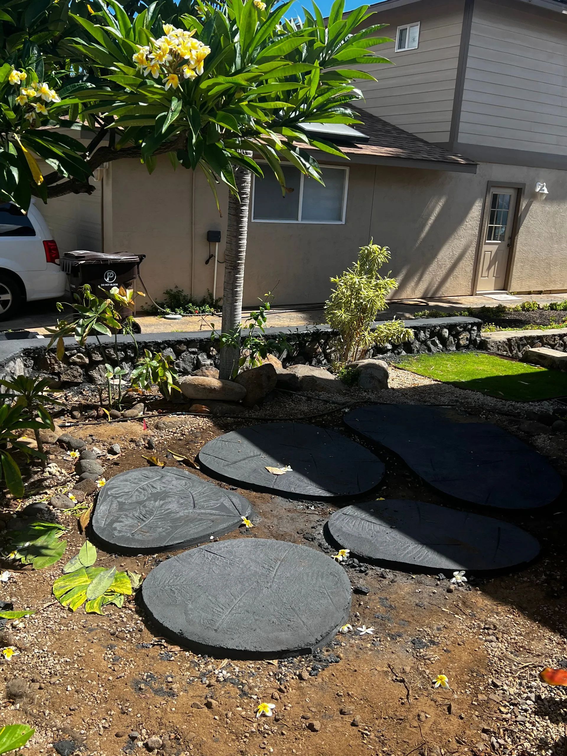 A house with a white van parked in front of it.
