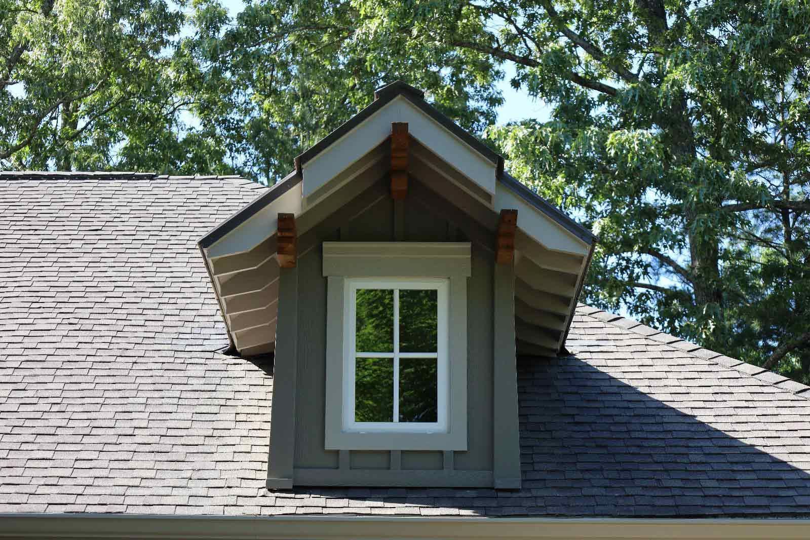 A Window On The Roof Of A House With Trees In The Background — Hendersonville, NC — Chameleon's Painting LLC
