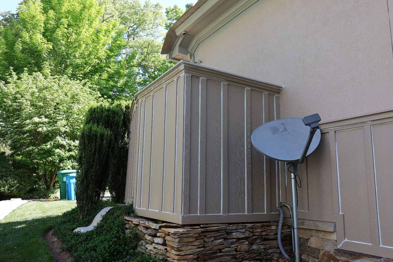 A Satellite Dish Is Sitting On The Side Of A House — Hendersonville, NC — Chameleon's Painting LLC
