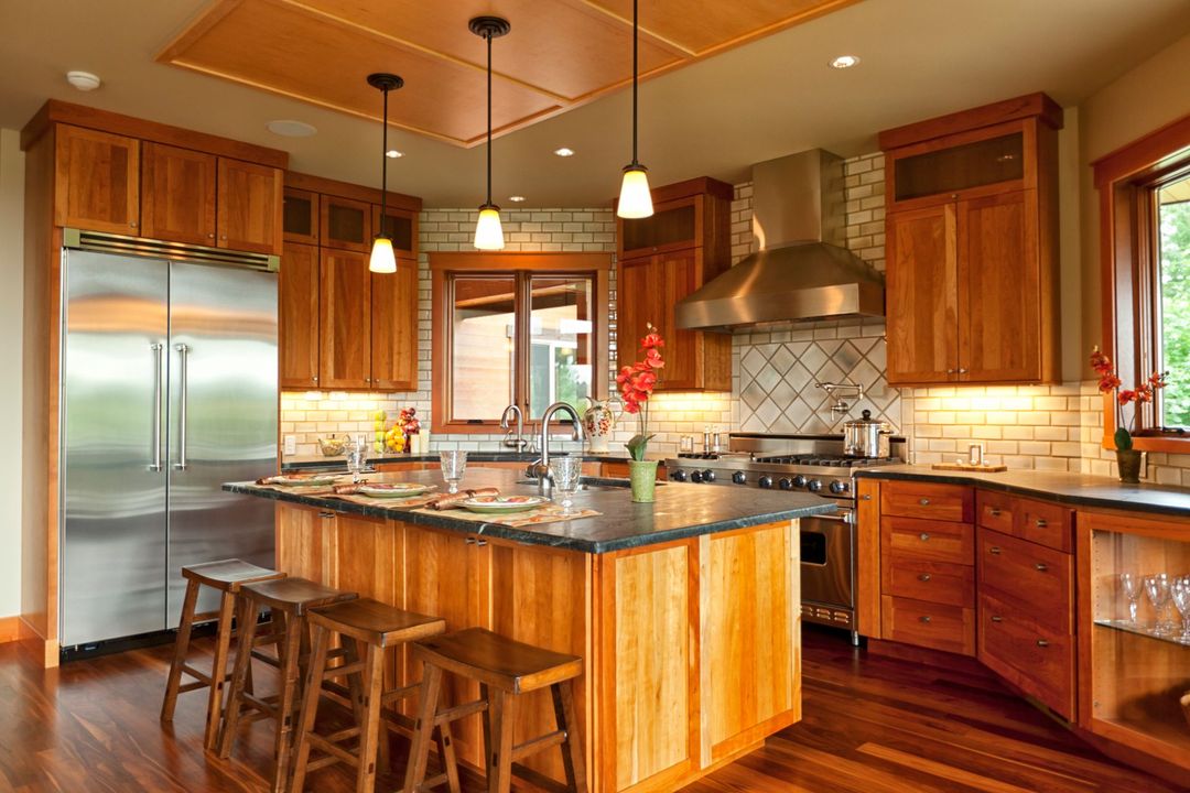 A kitchen with wooden cabinets and stainless steel appliances.