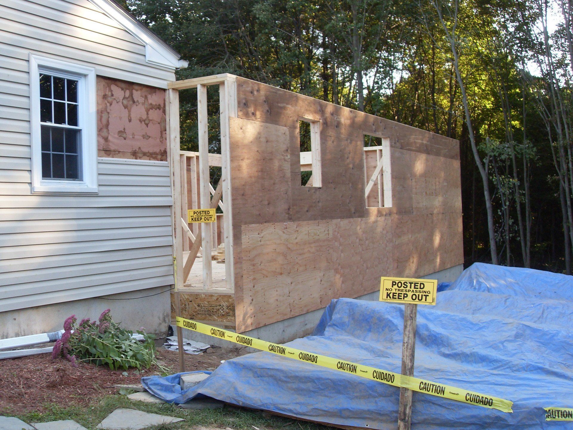 A house that is being built with a caution tape around it