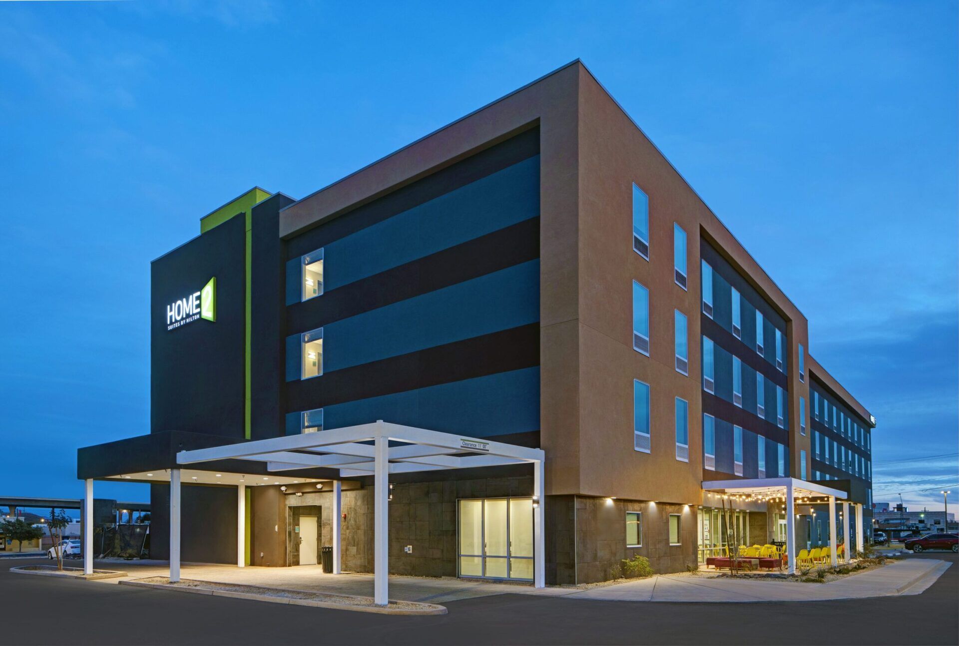 a large building with a lot of windows is lit up at night .